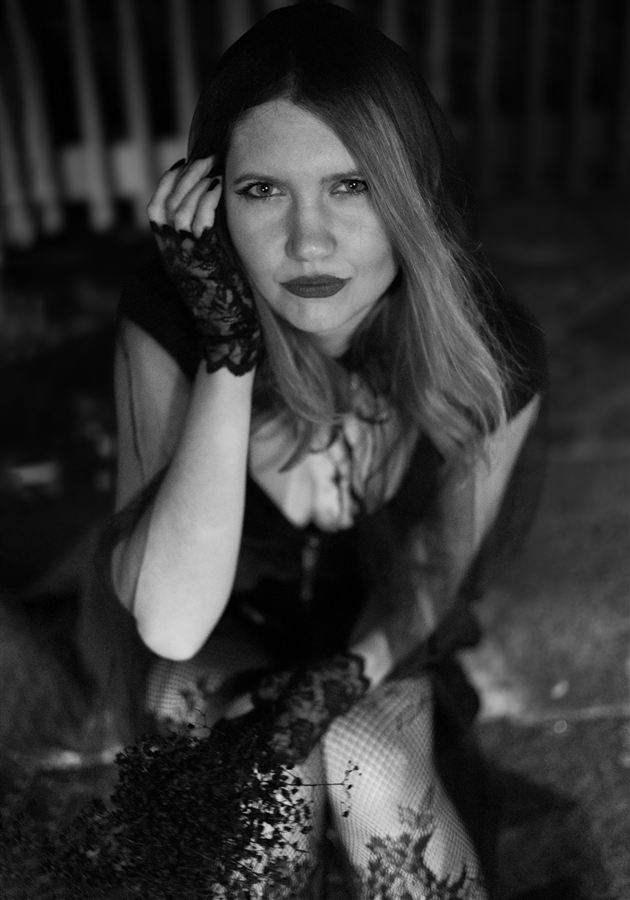 Black and white editorial portrait with lace gloves